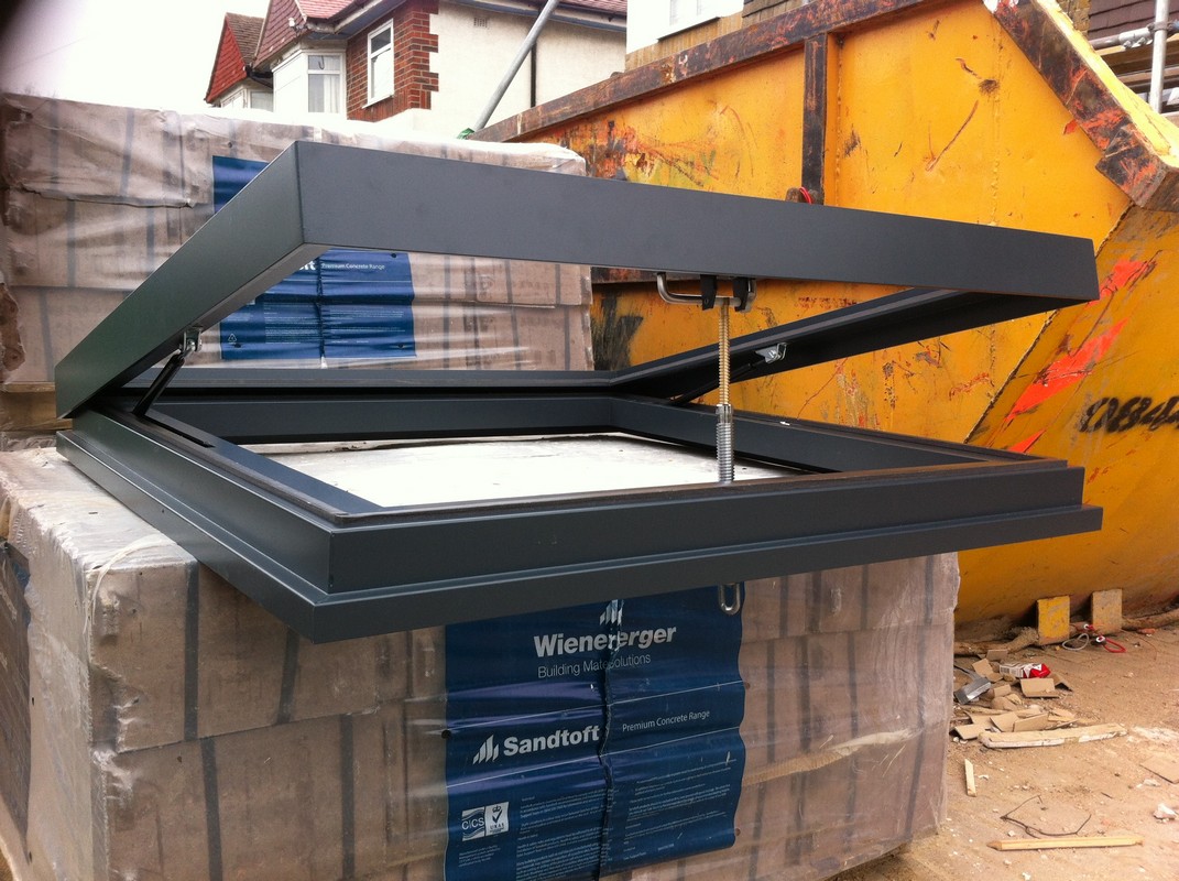 Opening flat roof skylight in anthracite grey installed in Shepherd's Bush